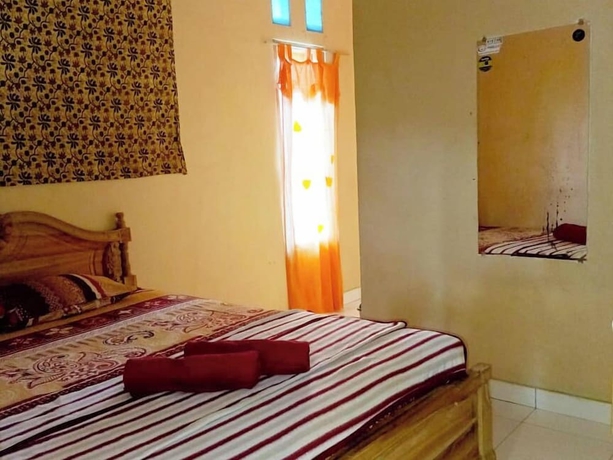 Imagen de la habitación del Hotel Lishafa Homestay. Foto 6