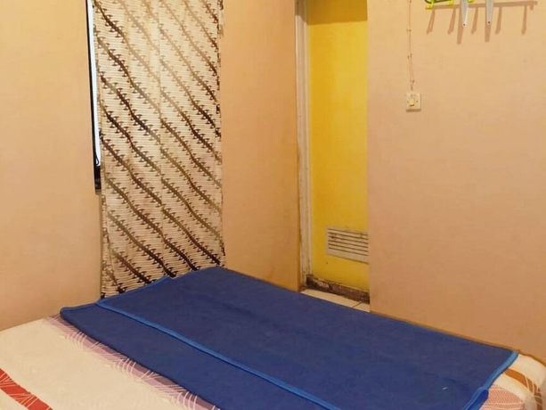 Imagen de la habitación del Hotel Lishafa Homestay. Foto 9