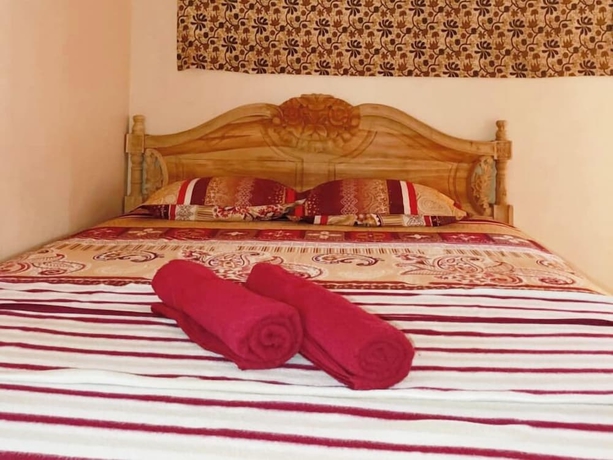 Imagen de la habitación del Hotel Lishafa Homestay. Foto 10
