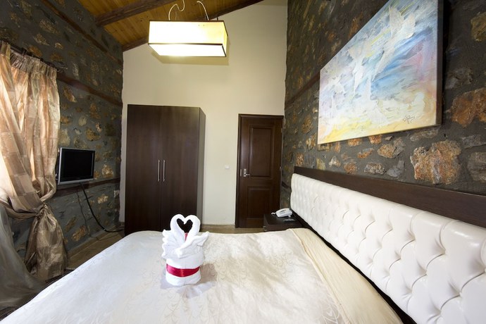 Imagen de la habitación del Hotel Lithos Hotel and Spa. Foto 13