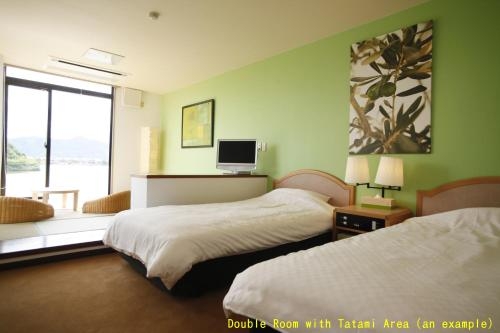 Imagen de la habitación del Hotel Little White Flower. Foto 6