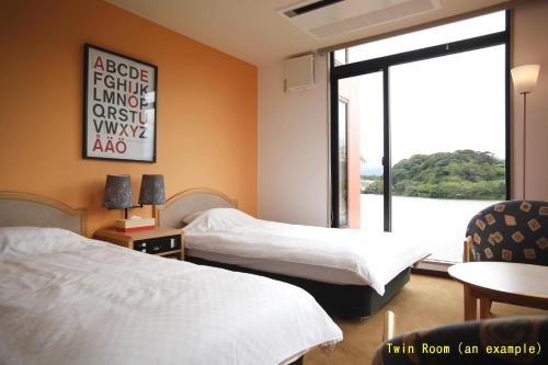 Imagen de la habitación del Hotel Little White Flower. Foto 7