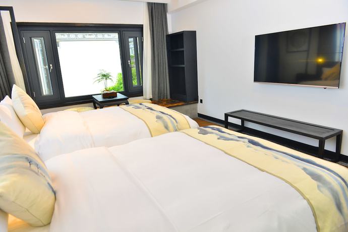 Imagen de la habitación del Hotel Liuheyunyan .dali. Foto 17