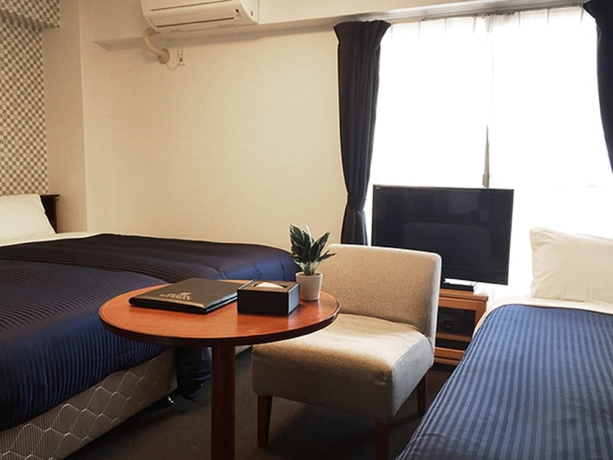 Imagen de la habitación del Hotel Livemax Budget Fuchu. Foto 17