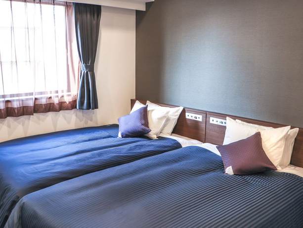 Imagen de la habitación del Hotel Livemax Chibaminato Ekimae. Foto 8