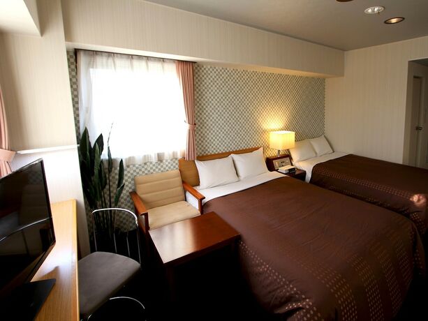 Imagen de la habitación del Hotel Livemax Chitose. Foto 11