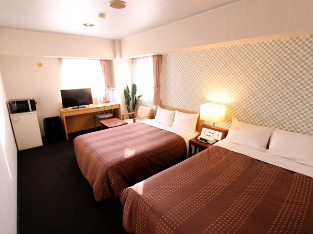 Imagen de la habitación del Hotel Livemax Chitose. Foto 13