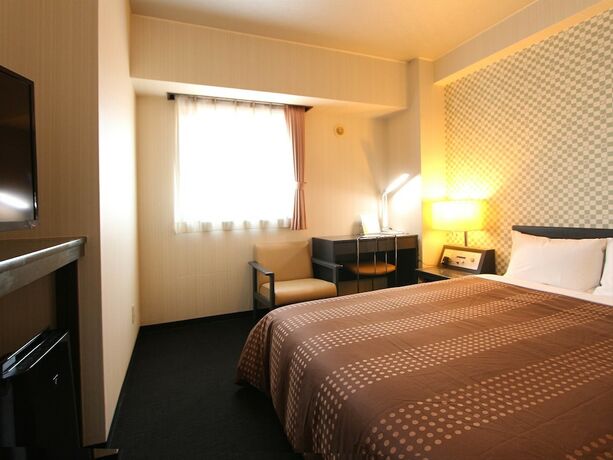 Imagen de la habitación del Hotel Livemax Chitose. Foto 14