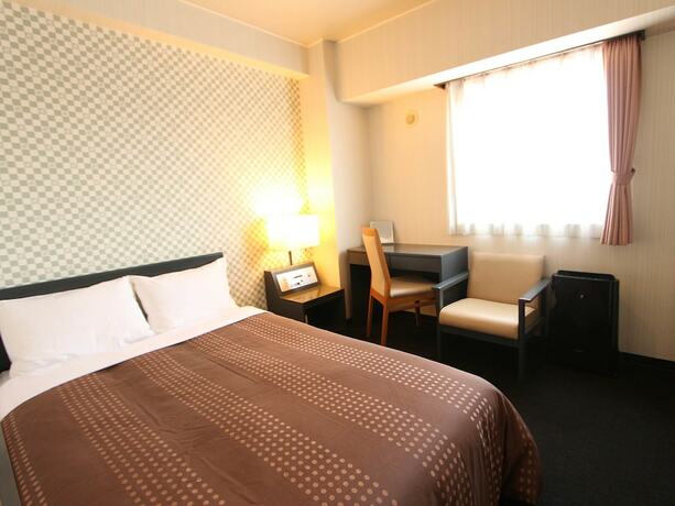 Imagen de la habitación del Hotel Livemax Chitose. Foto 18