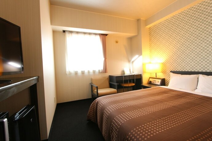 Imagen de la habitación del Hotel Livemax Chitose. Foto 23