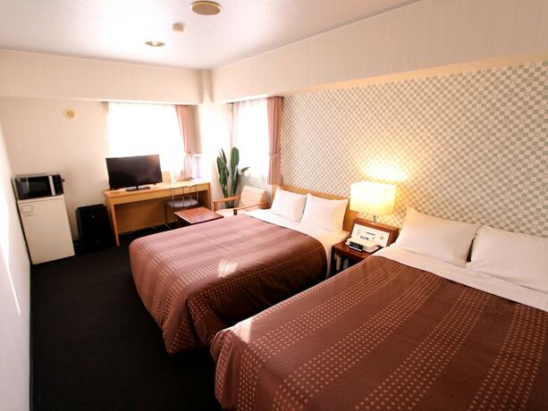 Imagen de la habitación del Hotel Livemax Chitose. Foto 25