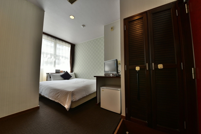 Imagen de la habitación del Hotel Livemax Naha Tomariko. Foto 6