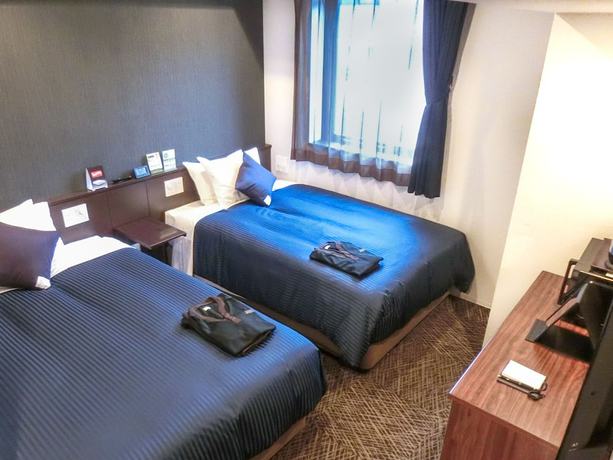 Imagen de la habitación del Hotel Livemax Premium Hiroshima. Foto 7