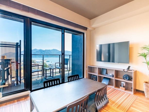 Imagen de la habitación del Hotel Livemax Resort Miyahama Onsen-ocean. Foto 10