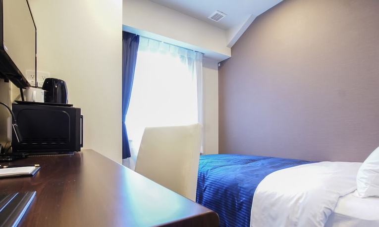Imagen de la habitación del Hotel Livemax Toyama. Foto 7