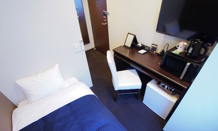Imagen de la habitación del Hotel Livemax Toyama. Foto 8