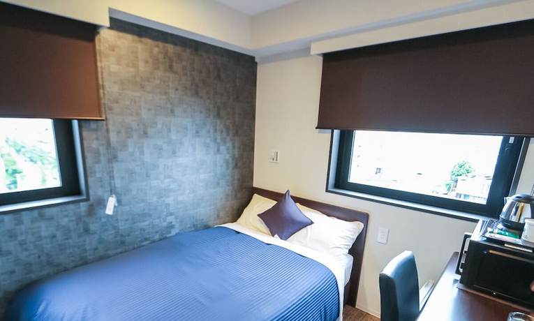 Imagen de la habitación del Hotel Livemax Toyama. Foto 12