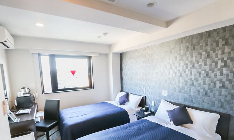 Imagen de la habitación del Hotel Livemax Toyama. Foto 14
