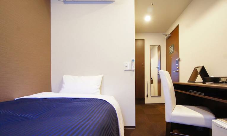 Imagen de la habitación del Hotel Livemax Toyama. Foto 15