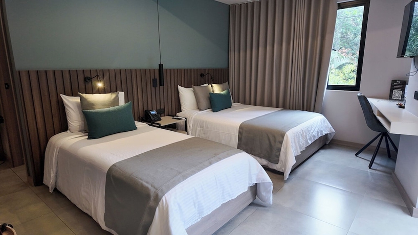 Imagen de la habitación del Hotel Living 35 Suites by Growing Group. Foto 2