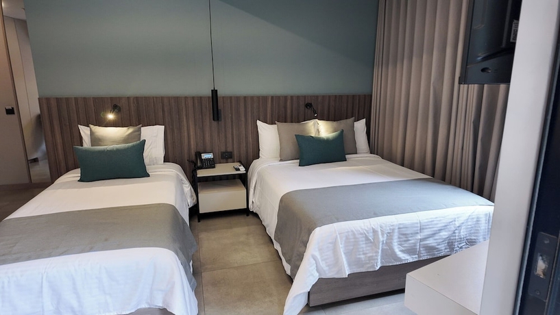 Imagen de la habitación del Hotel Living 35 Suites by Growing Group. Foto 3