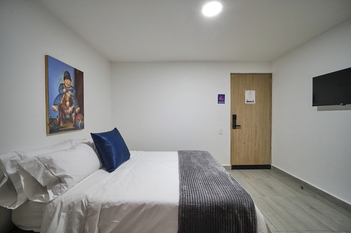 Imagen de la habitación del Hotel Living Blue. Foto 7