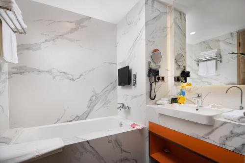 Imagen de la habitación del Hotel Liyang Jinfeng International. Foto 19