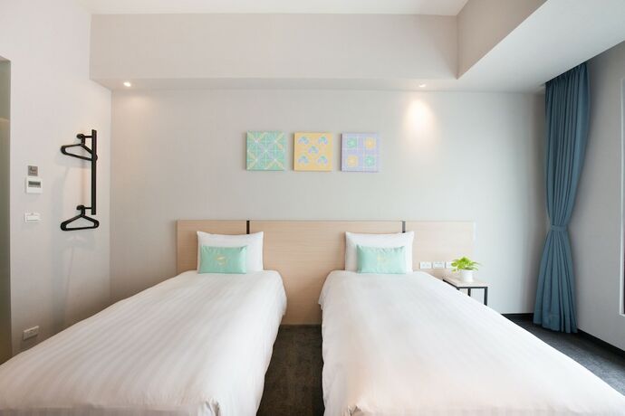Imagen de la habitación del Hotel Liyaou. Foto 13
