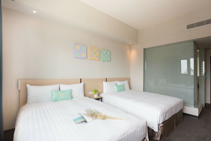 Imagen de la habitación del Hotel Liyaou. Foto 16