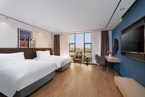 Imagen de la habitación del Hotel Liying - Guangzhou Baiyun International Airport Yingbin Avenue. Foto 15