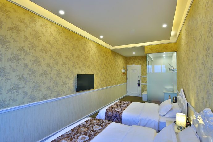 Imagen de la habitación del Hotel Liyuan Business. Foto 15
