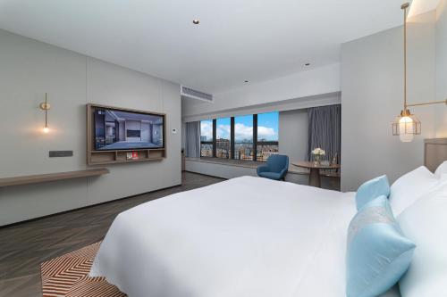 Imagen de la habitación del Hotel Liz Maoming Dianbai. Foto 15