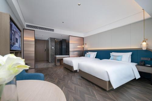 Imagen de la habitación del Hotel Liz Maoming Dianbai. Foto 16