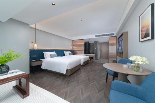 Imagen de la habitación del Hotel Liz Maoming Dianbai. Foto 17