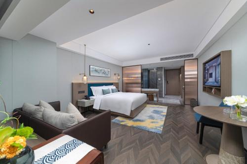 Imagen de la habitación del Hotel Liz Maoming Dianbai. Foto 18