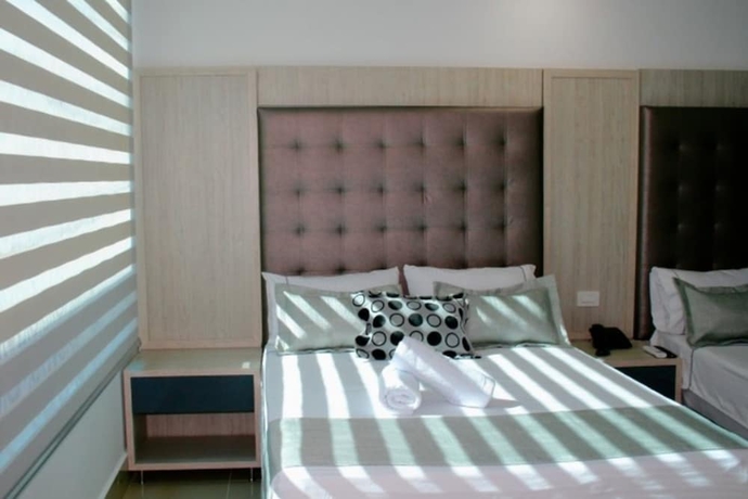 Imagen de la habitación del Hotel Lleras Express. Foto 12