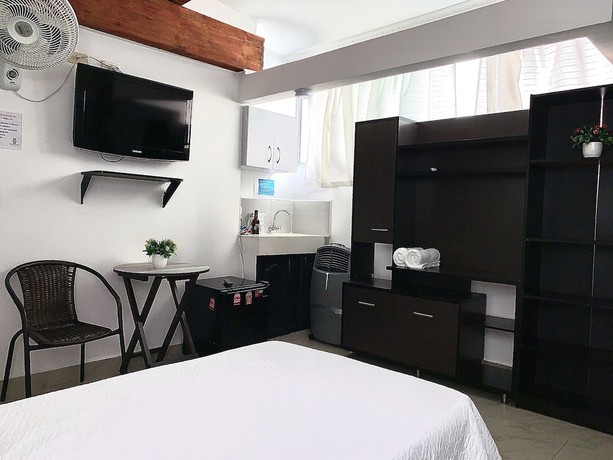 Imagen de la habitación del Hotel Lleras Premium. Foto 10