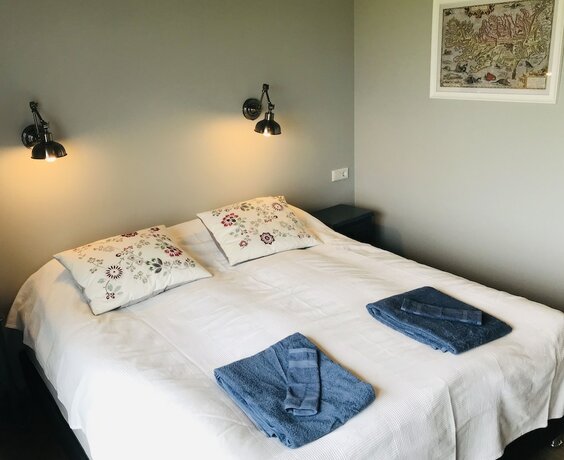 Imagen de la habitación del Hotel Loa´s Nest Guesthouse. Foto 17