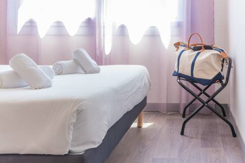 Imagen de la habitación del Hotel L'oasis. Foto 4