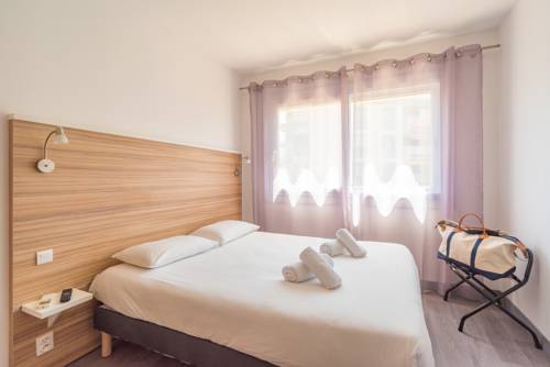 Imagen de la habitación del Hotel L'oasis. Foto 5