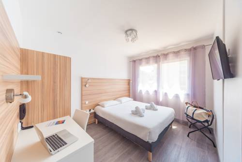 Imagen de la habitación del Hotel L'oasis. Foto 8