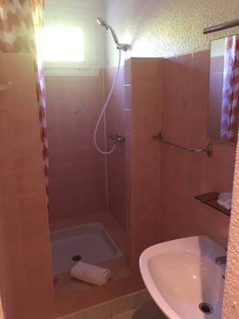 Imagen de la habitación del Hotel L'oasis. Foto 12