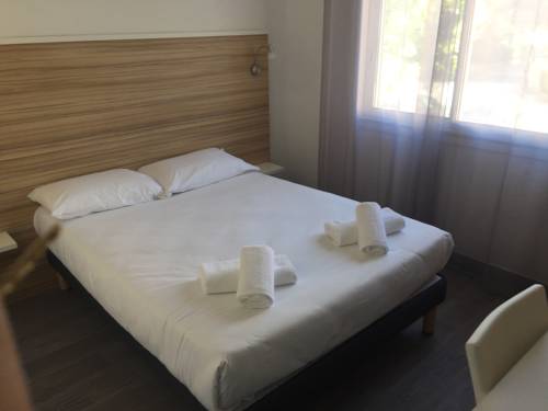 Imagen de la habitación del Hotel L'oasis. Foto 16