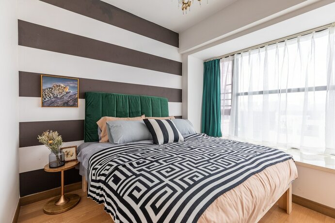 Imagen de la habitación del Hotel Locals Boutique Apartment Huafa Plaza 28. Foto 19