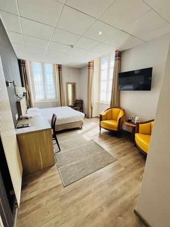 Imagen de la habitación del Hotel Logis Au Grand Hotel. Foto 12