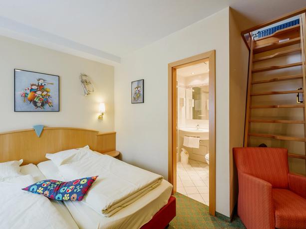 Imagen de la habitación del Hotel Logis Gourmet & Relax Wellness Hotel De La Sure. Foto 5