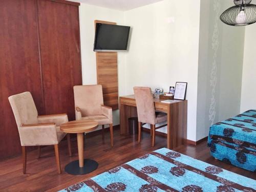 Imagen de la habitación del Hotel Logis Hôtel D'angleterre. Foto 5