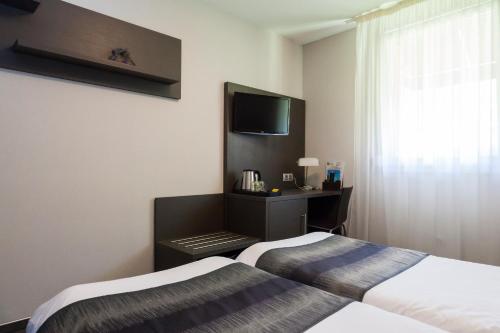 Imagen de la habitación del Hotel Logis Le Mas De Jossyl. Foto 8