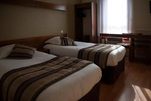 Imagen de la habitación del Hotel Logis Le Sainte Mere. Foto 6