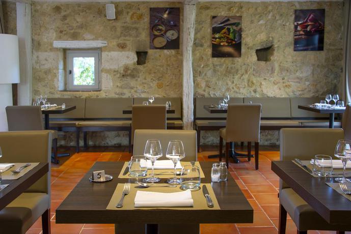 Imagen del bar/restaurante del Hotel Logis s - Et Restaurant La Ferme De Flaran. Foto 2